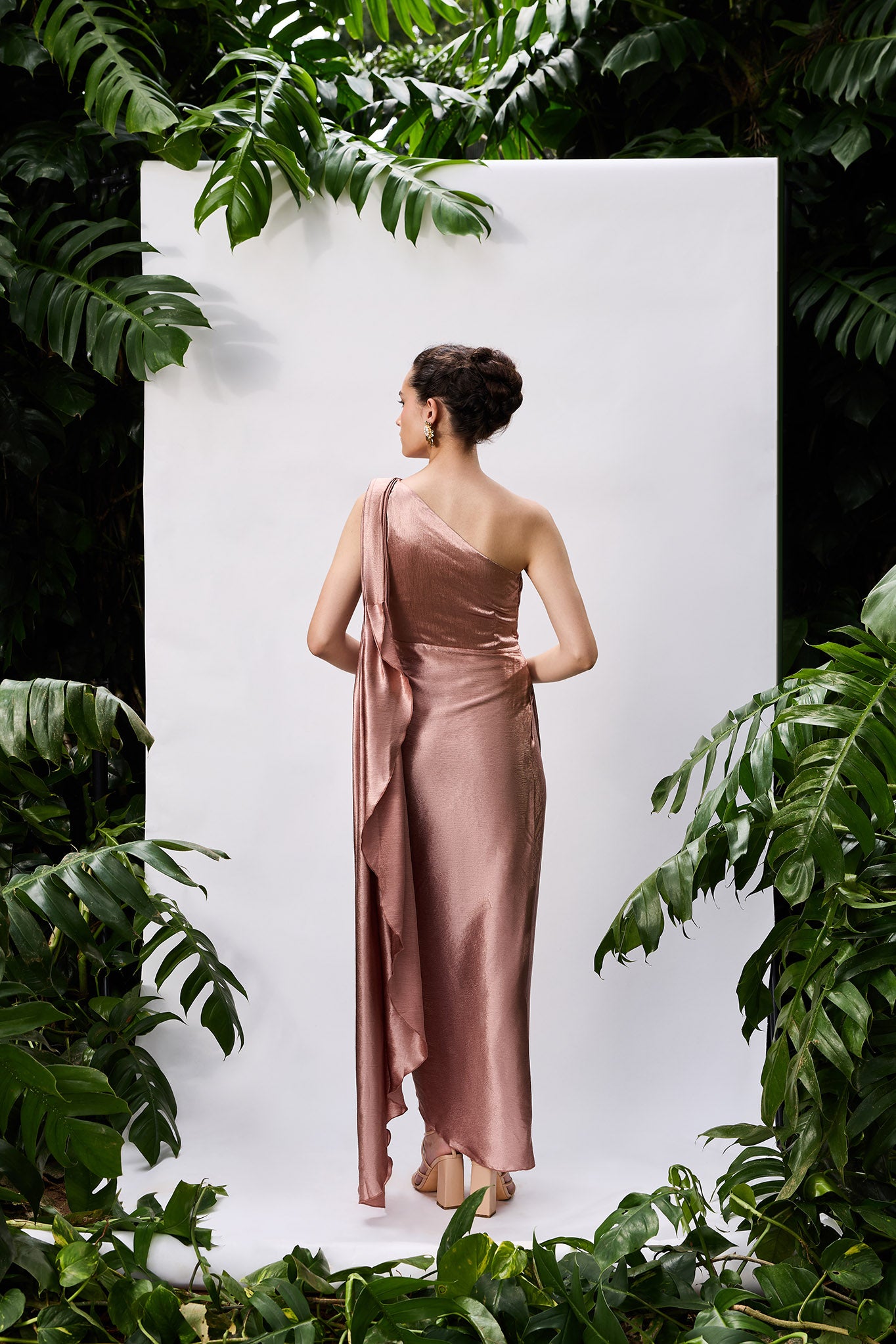 Back view of a rose gold cocktail dress
