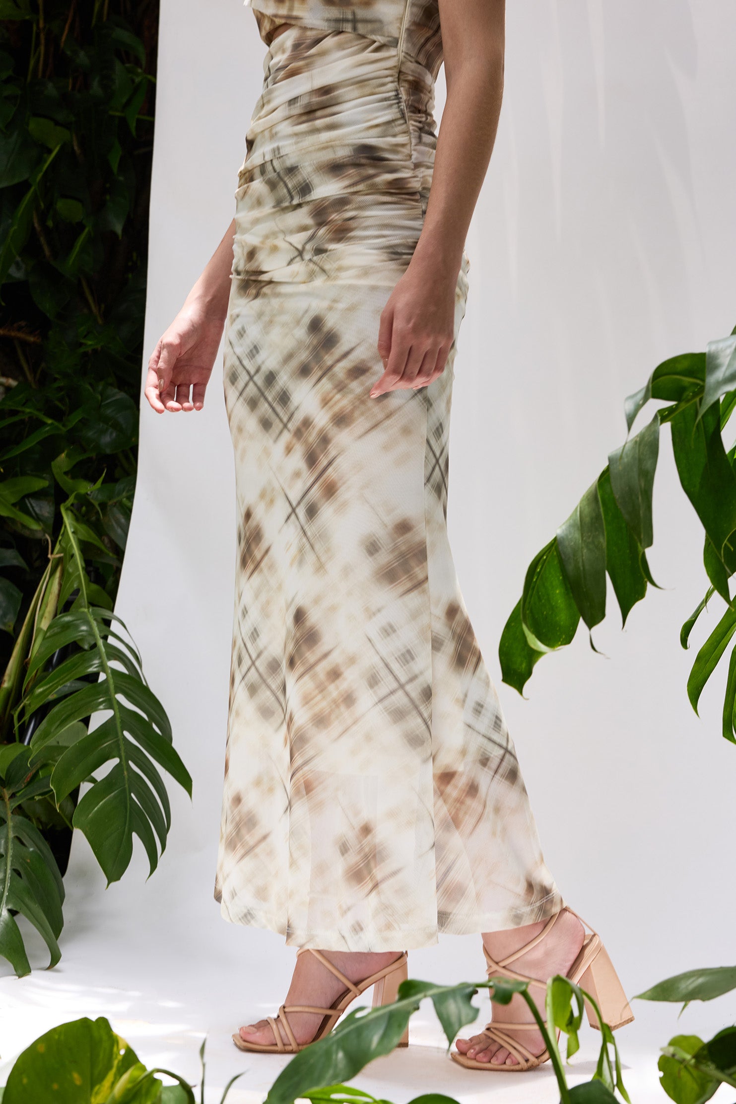 Close-up of Pineapple Dress — draped bodice and sculpted fish-cut hemline