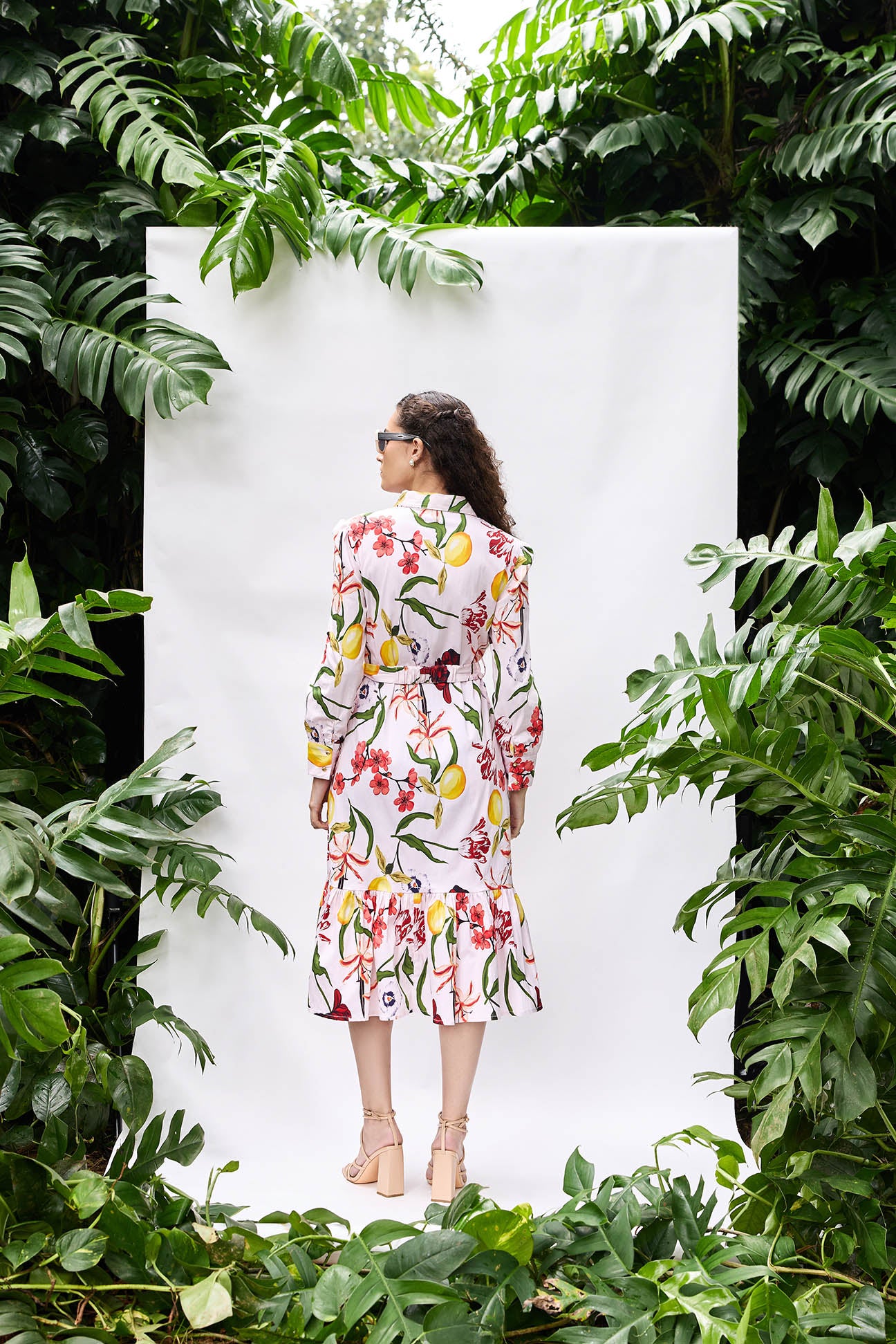 Model wearing Bouquet Dress — printed shirt dress with belt and side pockets