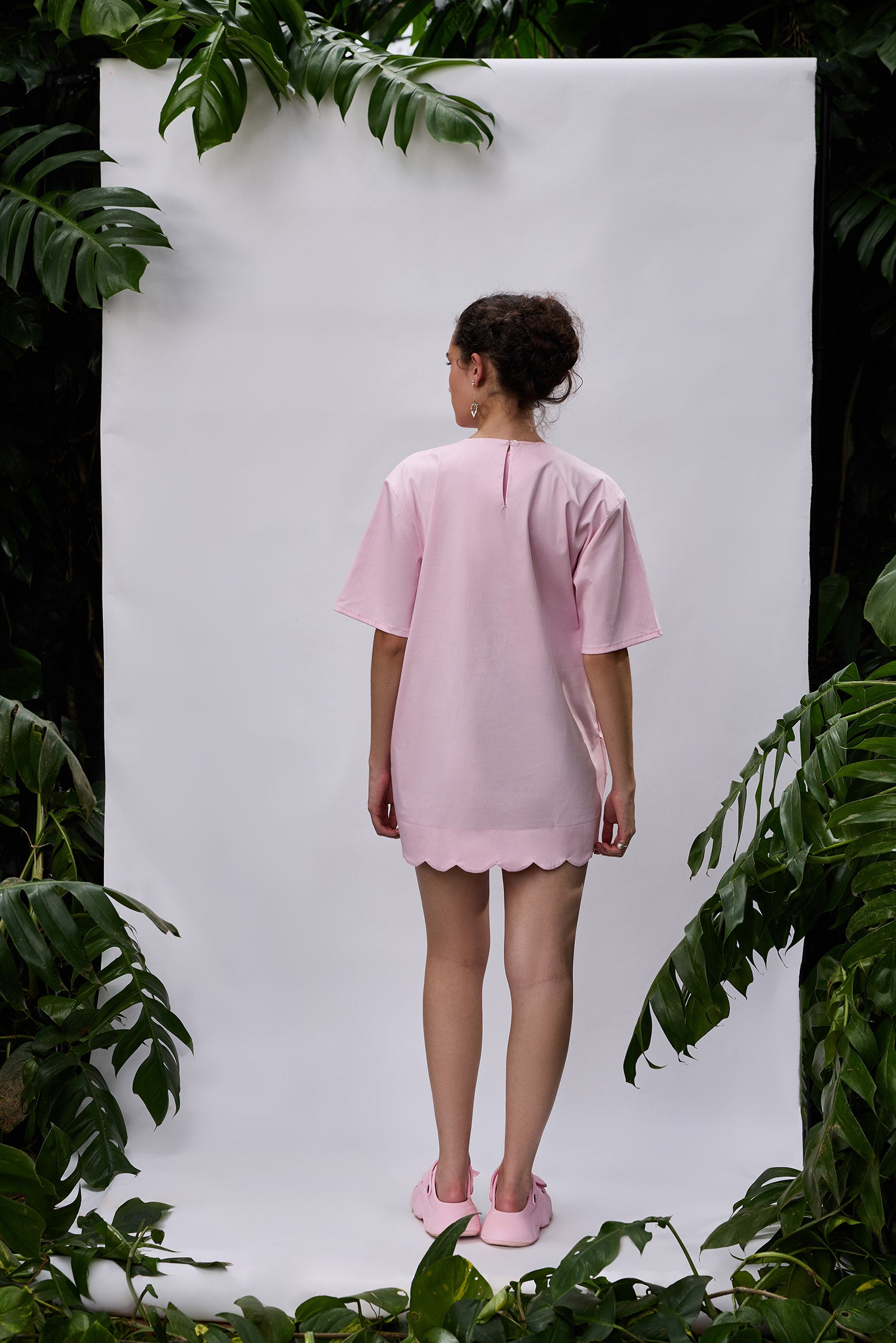Back view of Heart Bloom Dress — oversized silhouette with unique hemline