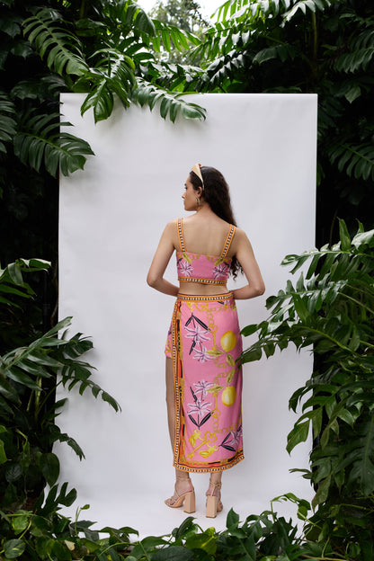Back view of Lilly Bloom Co-ord Set — strappy crop top and high-slit skirt in pink satin
