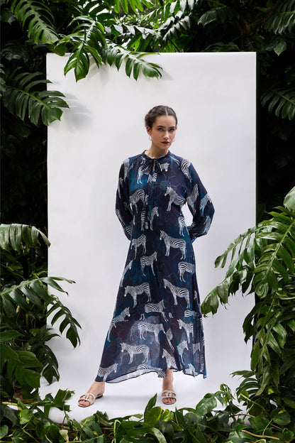 Model wearing Sapphire Zebra Pintucked Maxi — relaxed resort-wear silhouette in sapphire blue
