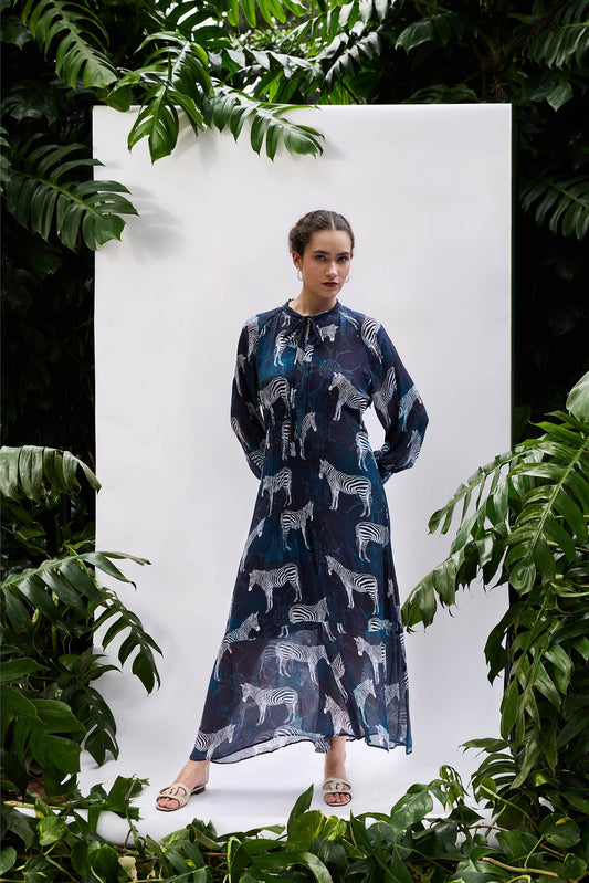 Model wearing Sapphire Zebra Pintucked Maxi — relaxed resort-wear silhouette in sapphire blue
