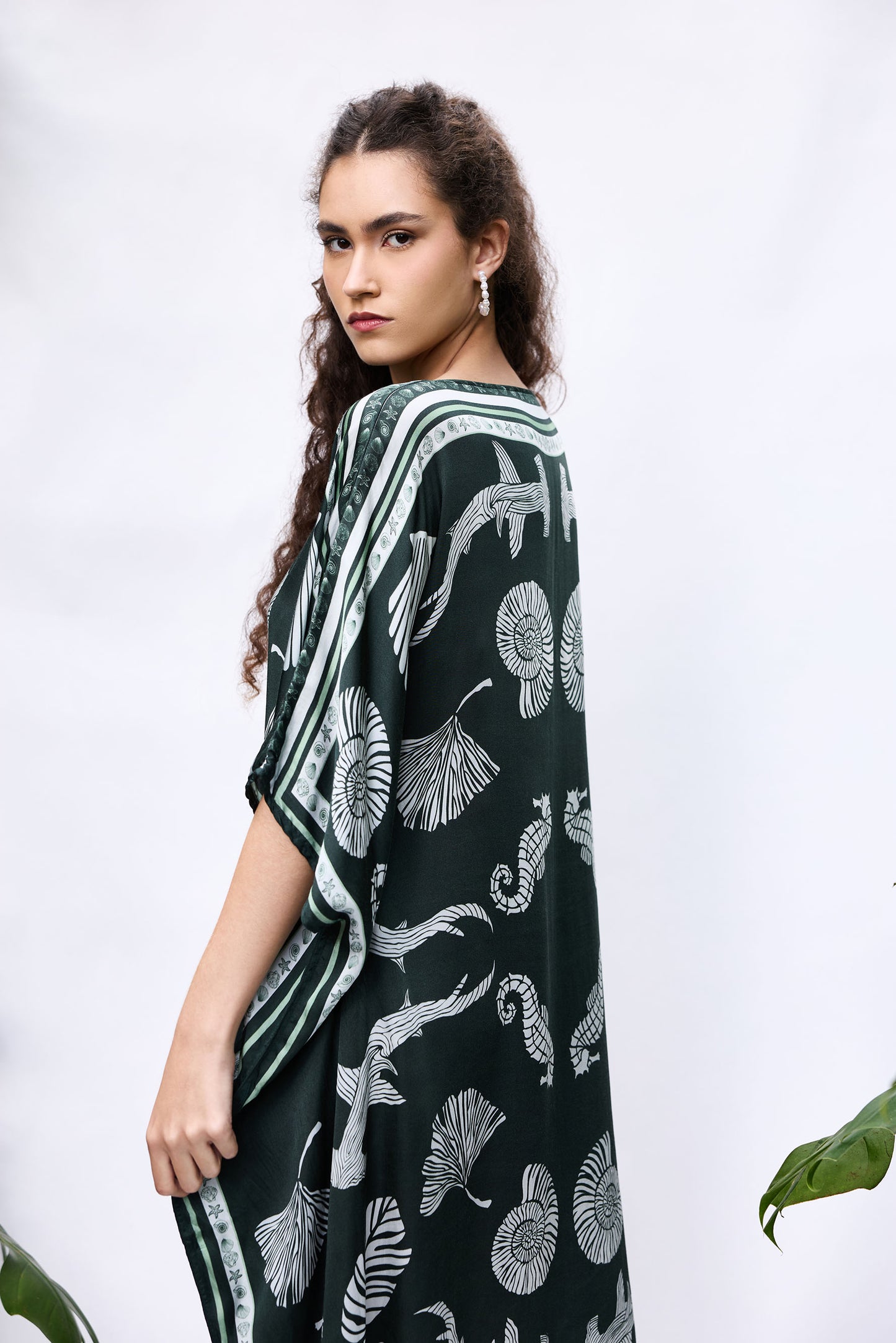 Model wearing She Shell Kaftan — flowy resort cover-up in pure modal satin