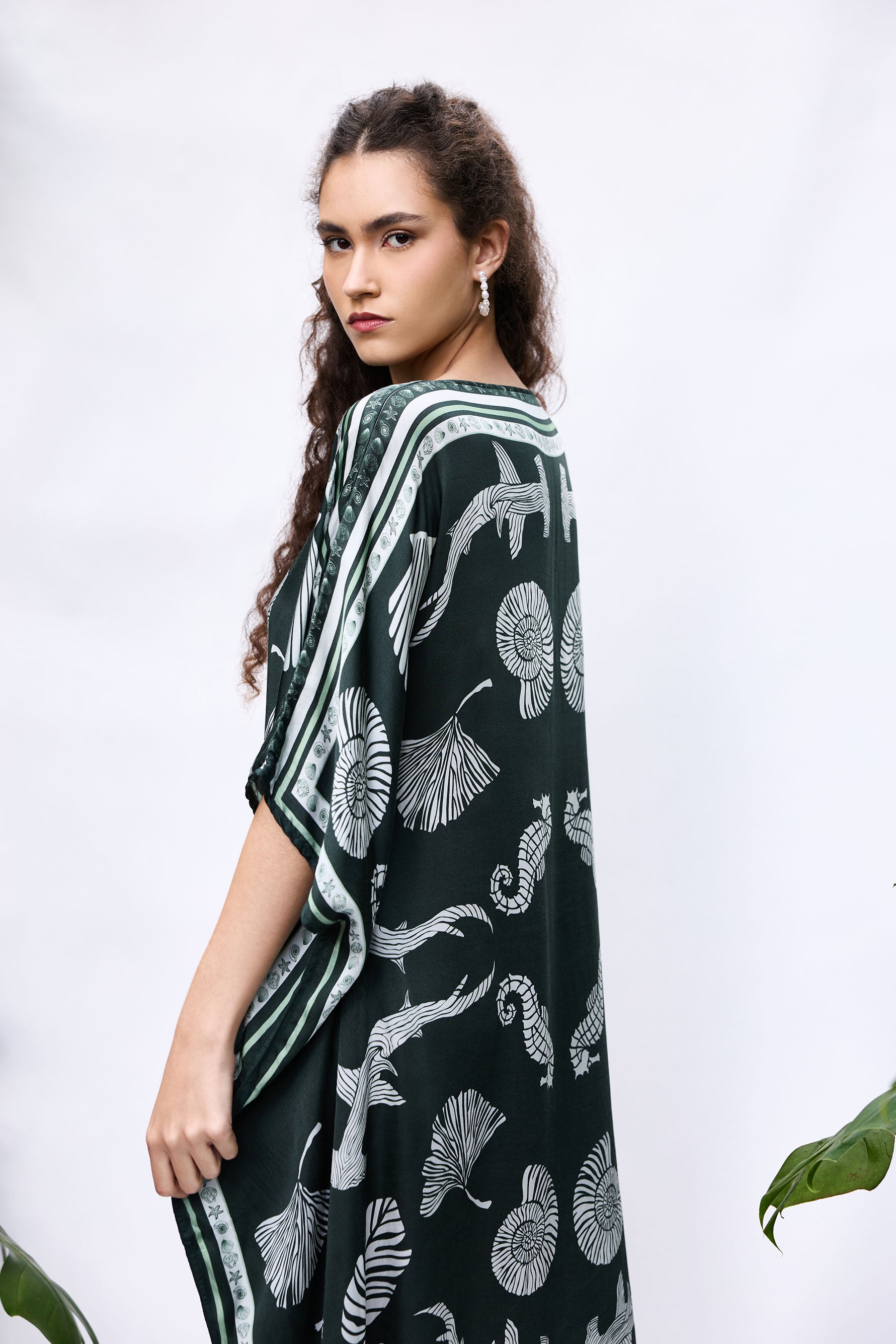Model wearing She Shell Kaftan — flowy resort cover-up in pure modal satin