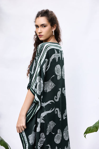 Model wearing She Shell Kaftan — flowy resort cover-up in pure modal satin