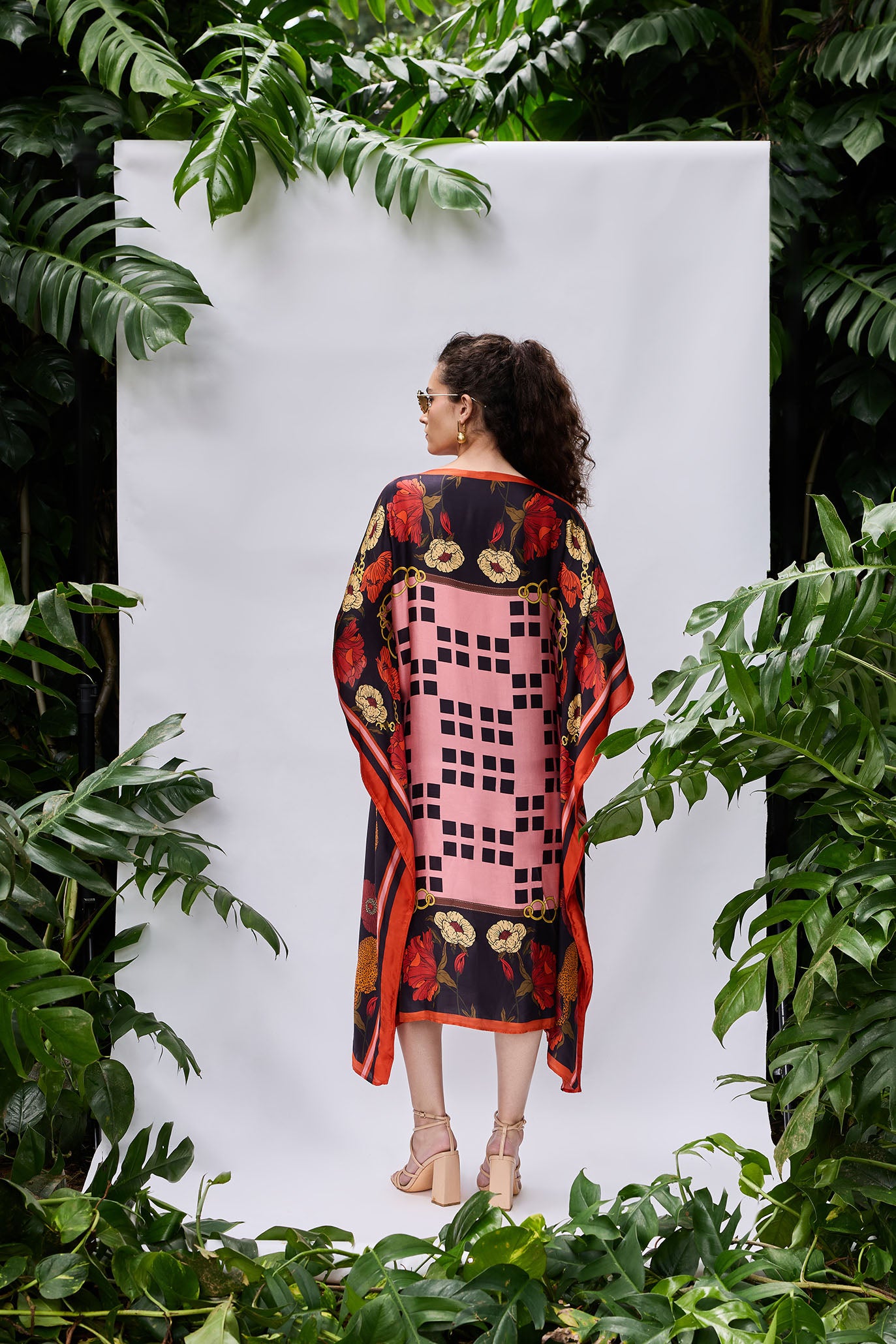 Back view of Rosette Kaftan — relaxed fit and vibrant floral pattern